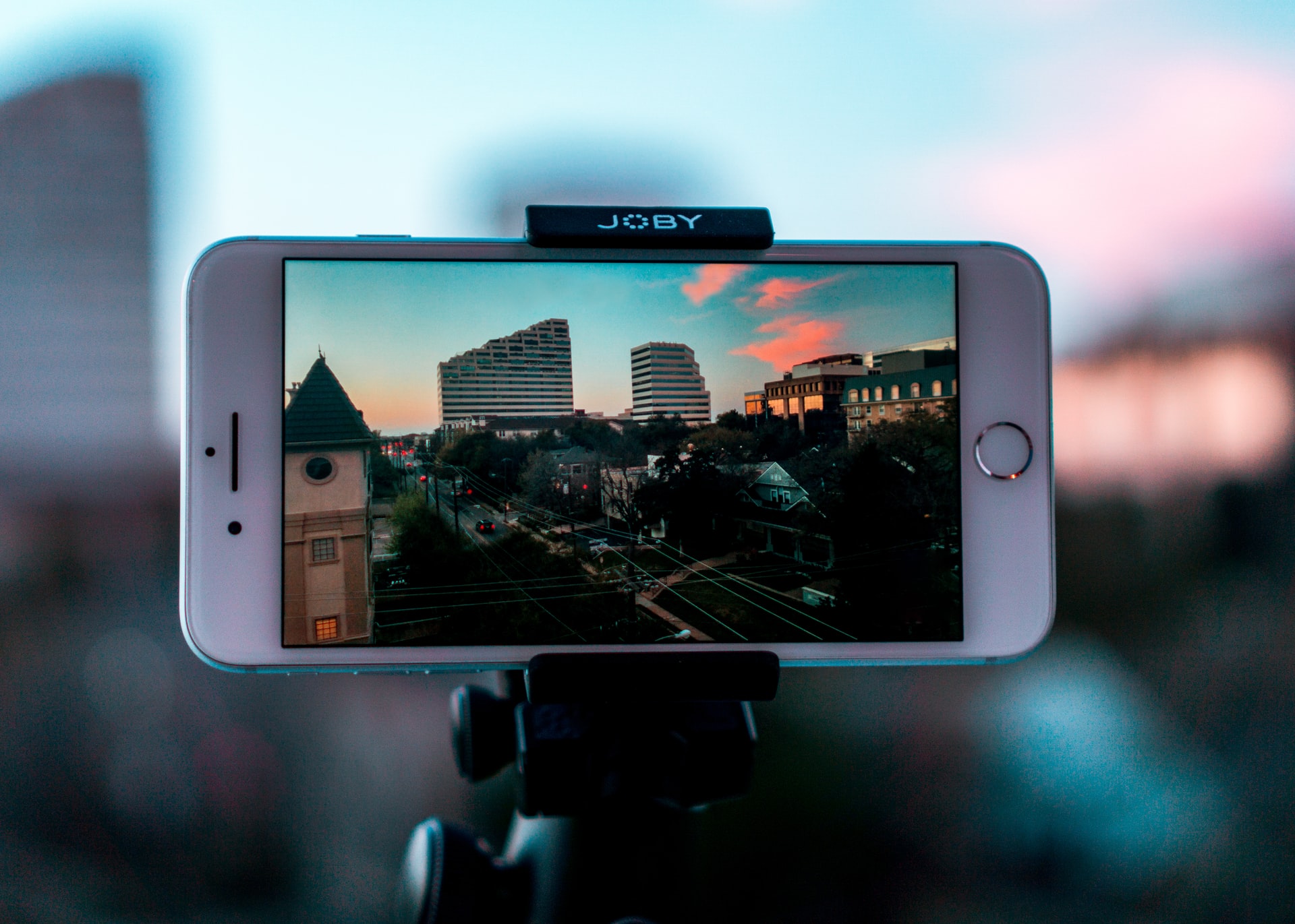 White iPhone capturing city landscape