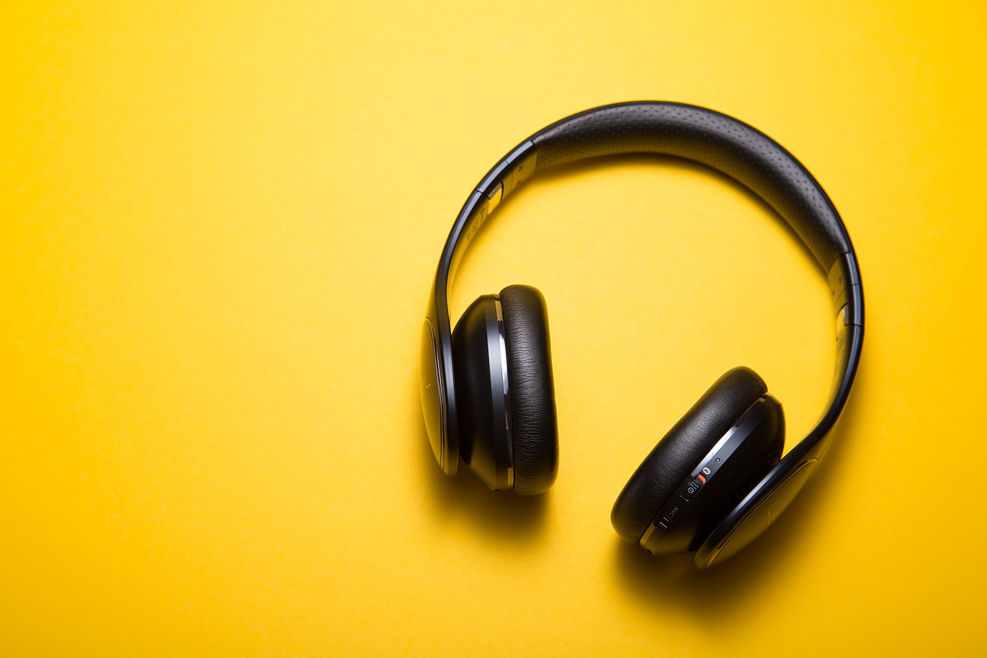 Headset on bright yellow background