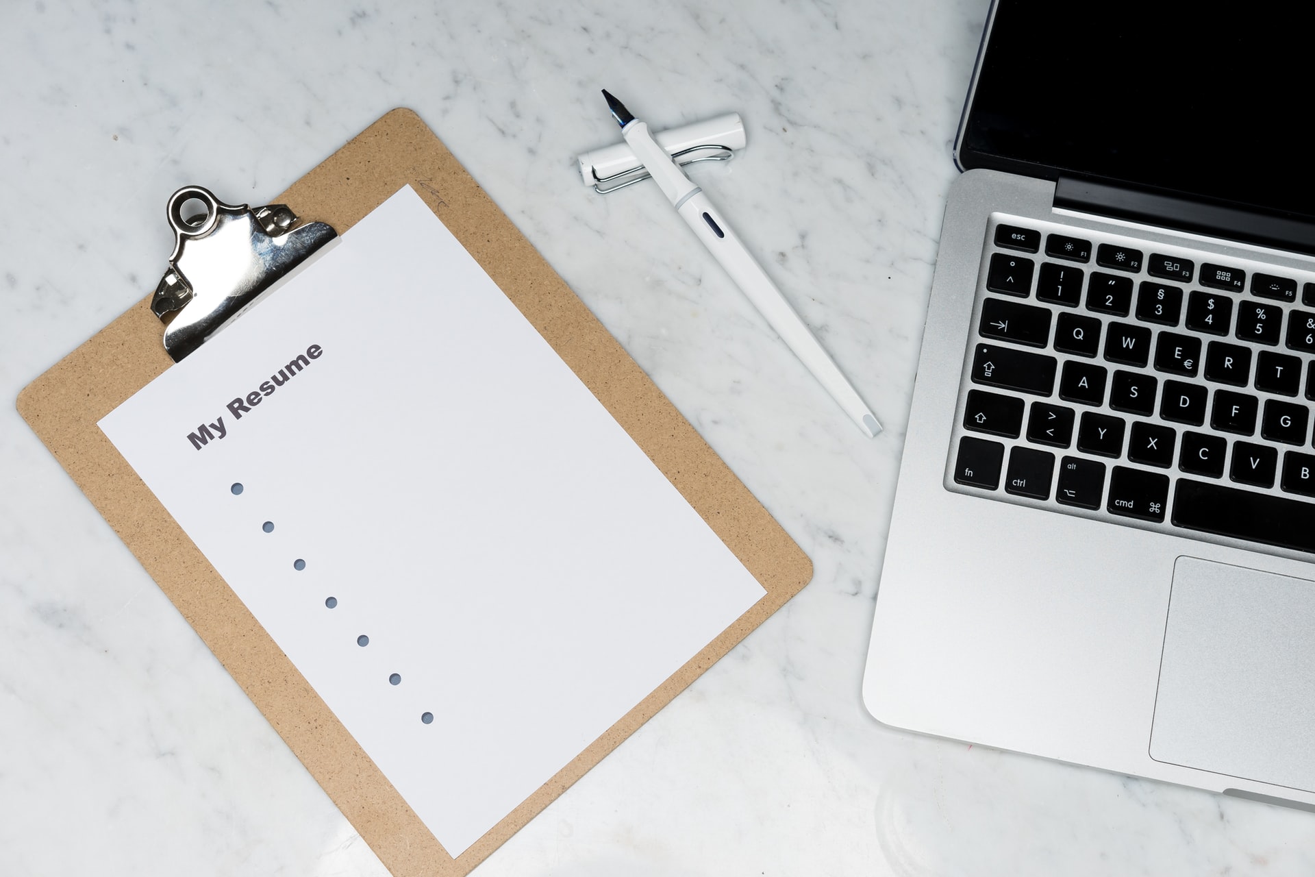 Laptop and resume on a desk