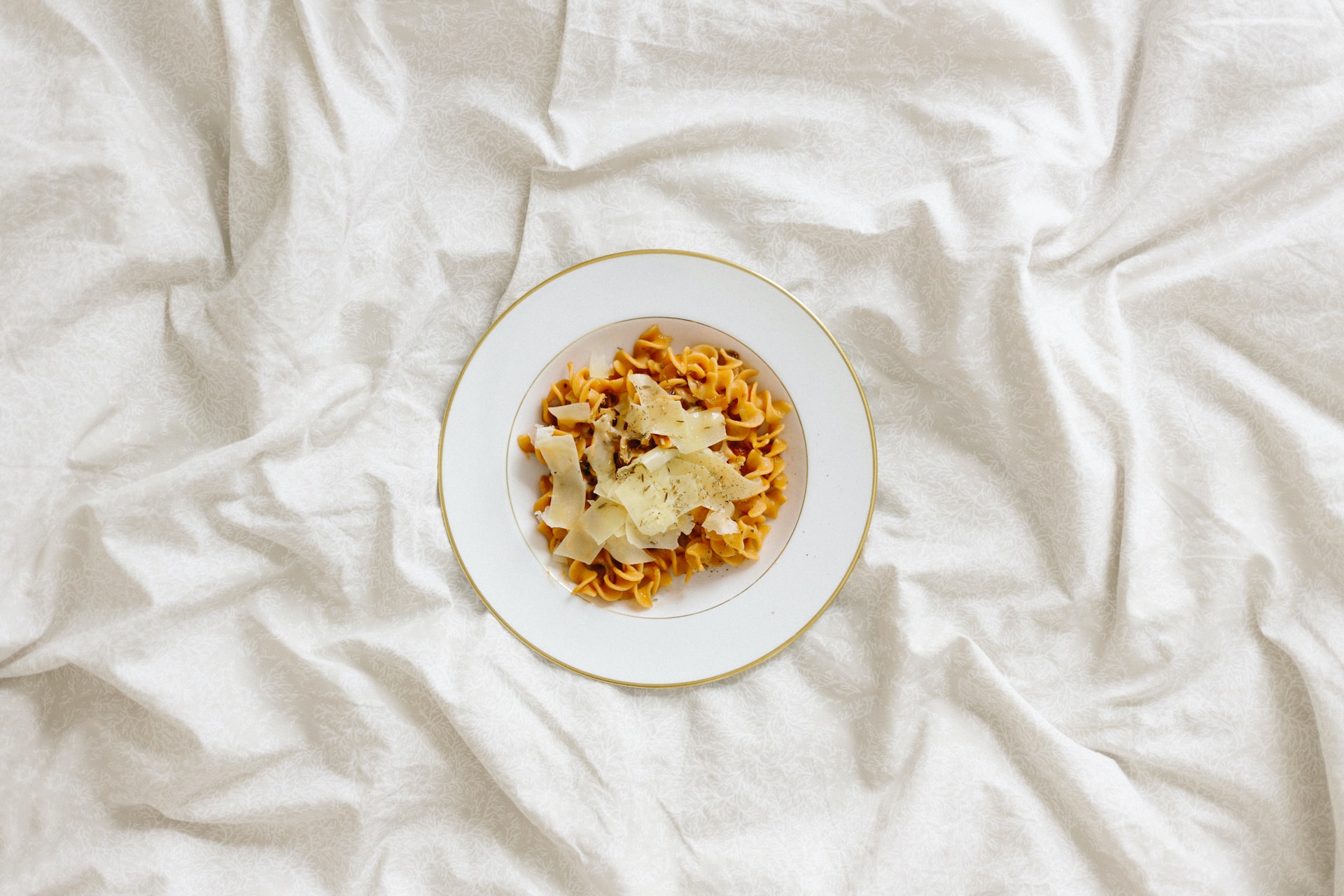 Pasta plate on white textured background