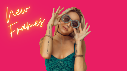 Woman wearing sunglasses on a bright pink background with "new frames" written on it